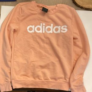 An extra small light pink Adidas Crewneck